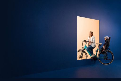 Woman on bike with child